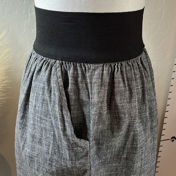 Love Culture wide elastic waistband miniskirt w/ 2 front pockets & faux buttons. - Picture 3 of 8